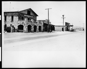 Rosamond street scene showing Hotel Rosamond, a general store, and a gasoline station, ca.1900-1920