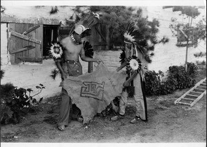 Maricopa Indians with sheep(?) sign on dear skin, ca.1900