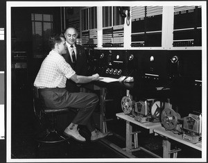 Supervisor and worker at the General Telephone Company test panel, ca.1940