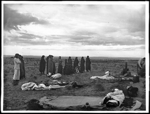 Group of Hopi Indians visiting the campsite of Dr. George Wharton James near the village of Shonguapavi, ca.1900