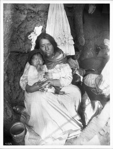 A Yaqui Indian mother and her three children, Arizona, ca.1910