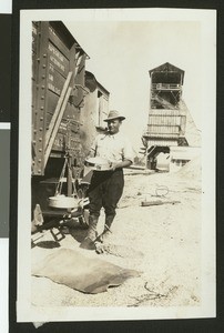 Quarry worker panning rocks, March 1928