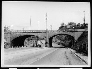 Concrete viaduct crossing a street and railroad tracks