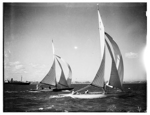 View of a close race between two yachts with their sails well filled out