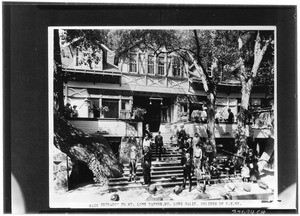 People gathered on the entrance steps of Mt. Lowe tavern, Altadena