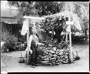 Don Eugene Plummer at his decorative fountain in Hollywood