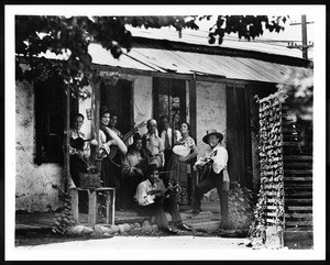 Portrait of Spanish (Mexican?) musicians on the patio of the Avila adobe, Los Angeles, ca.1900-1909