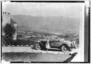 Car on a driveway of Flintridge Country Club with mountains in the background, La Cañada Flintridge