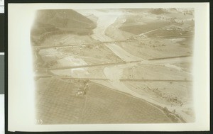 Aerial view of flooding near Colton, showing broken bridges, ca.1930