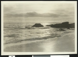 View of a shore showing rocks at right