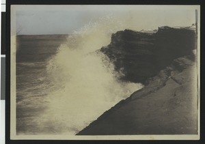 Surf breaking on rocks in La Jolla, ca.1900