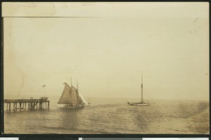 Two sailboats near a docking area of perhaps Santa Barbara, ca.1930