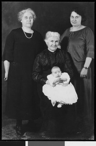 Portrait of three women and a baby