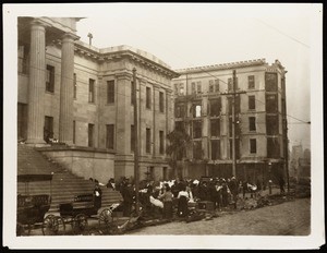 San Francisco earthquake damage, showing refugees in front of a damaged building, 1906