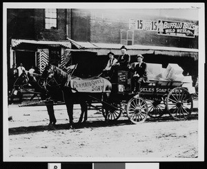 Los Angeles Soap Company building delivery wagon with John A. Forthmann, Jr. seated on side of wagon, 1900