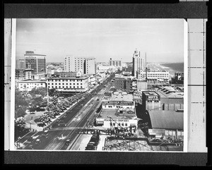 Birdseye view of a street in Long Beach showing a dance studio, restaurant, and theatre, ca.1925