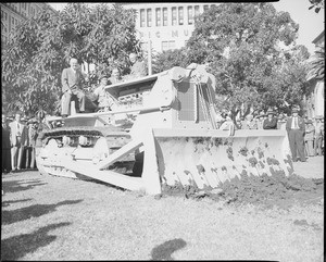 Crowd gathered around a bulldozer for the groundbreaking of the Pershing Square garage in Los Angeles, 1951