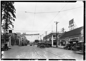 A view of Figueroa Street looking north from Venice Boulevard, showing view of automobile row, October 30, 1925