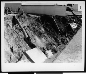 Flood damage to Warner Brothers Studio, showing men at left, 1938