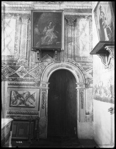 Painting on wall around door at right side of altar at Mission Santa Inez, ca.1900