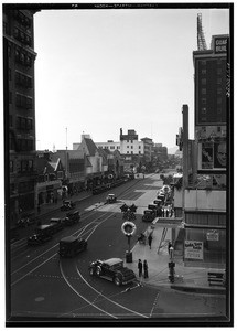 Birdseye view of Hollywood Boulevard, showing metallic wreaths with pictures