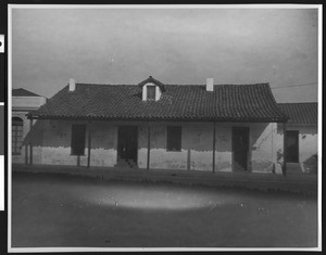 Exterior view of the Arallanes house, the oldest adobe in Santa Barbara, later used as a Community Welfare Center, ca.1937