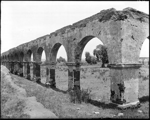 View of the quadrangle of Mission San Luis Rey de Francia as seen from the arcade, Orange County, ca.1900