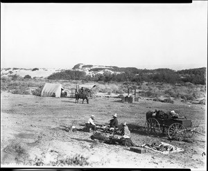 Group of people making camp at Indian Wells on the Butterfield Stage Line, ca.1904