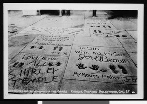 Footprints and handprints in concrete outside of Grauman's Chinese Theater, ca.1938