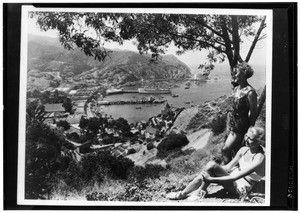 Two women in bathing suits overlooking Avalon Bay on Catalina Island