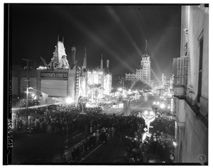 View of Hollywood Boulevard, showing Grauman's Chinese Theater illuminated for the movie premier of "Hell's Angels", ca.1929