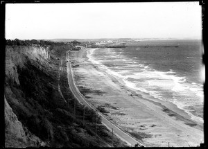 View of Santa Monica Beach looking south from the Palisades, showing the city in the distance, ca.1908