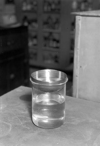 Metal bowl on top of a glass beaker