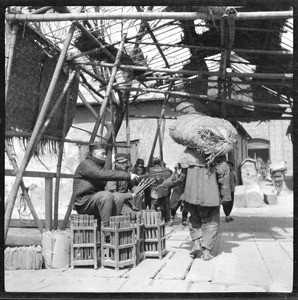 Accountants tallying cargo in China, ca.1900