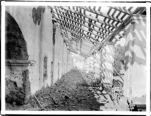 Ruins of the exterior corridor of Mission La Purisima Concepcion, ca.1900