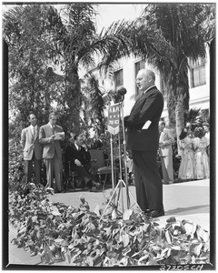 Man making an address (presumably at a public meeting near Frank Putnam Flint Fountain)