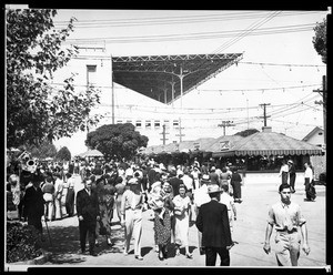 View of the midway of the Los Angeles County Fair, showing stands and fairgoers, ca.1933-1937