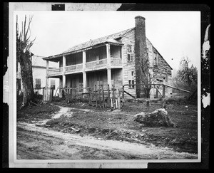 Exterior view of the old home of T. Robertson in disrepair, ca.1930