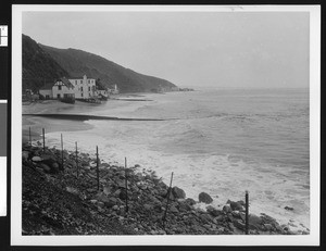 Beach groins which keep water from eroding from the coast, showing buildings along the coast, 1953