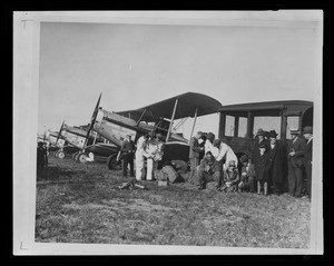 Pilots readying an aircraft for the first air mail flight by Western Air Express, April 17, 1926