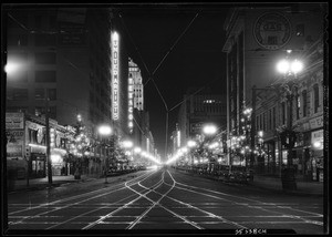 Broadway looking north-east from 10th Street (now, Olympic Boulevard), showing Christmas decorations along the sides of the street, December 1930