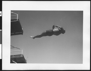 Male diver in mid-air, ca.1930