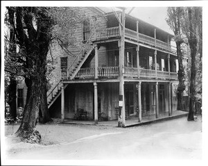 View of the main business street in Dutch Flat showing the old hotel, ca.1930