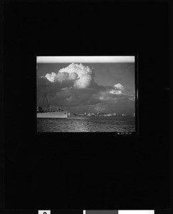 View of the Long Beach skyline with ship passing by in foreground