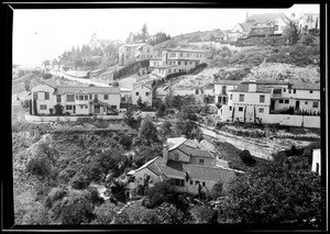 View of several Spanish-style homes on the side of a hill in Hollywood, March 11, 1930