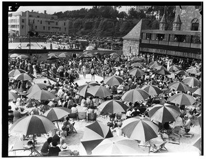 People watching a swimsuit contest on a beach in Santa Monica