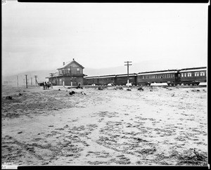 Desert Station of Southern Pacific Railroad at Palmdale showing a train in station, ca.1895