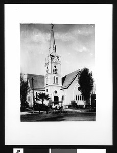 Exterior view of the San Bernardino Congregational Church, showing a horse-drawn carriage in front, ca.1903