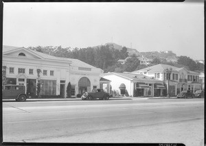 Exterior view of retail businesses along Sunset Boulevard in Los Angeles, ca.1935