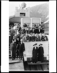 Group portrait of passengers on and around an incline rail car at the Mount Lowe Incline at Echo Mountain